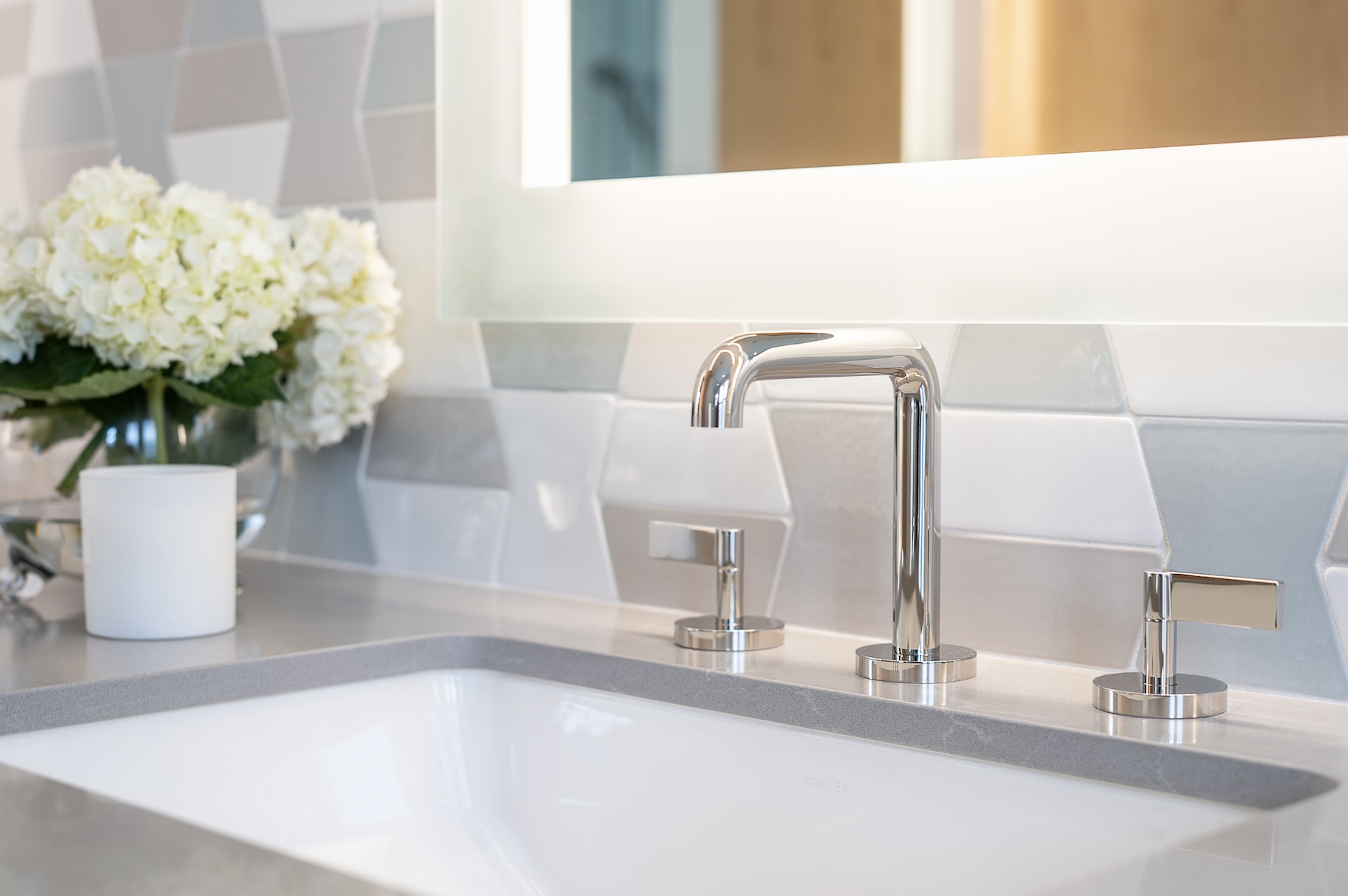 stainless sink primary bathroom white flowers in vase