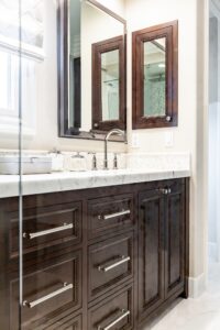 Dark Cabinetry White Countertops Bathroom Vanity
