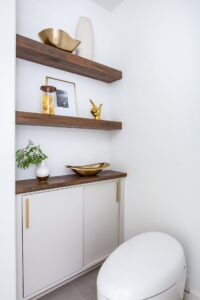 Floating Shelves Next To Modern Toilet