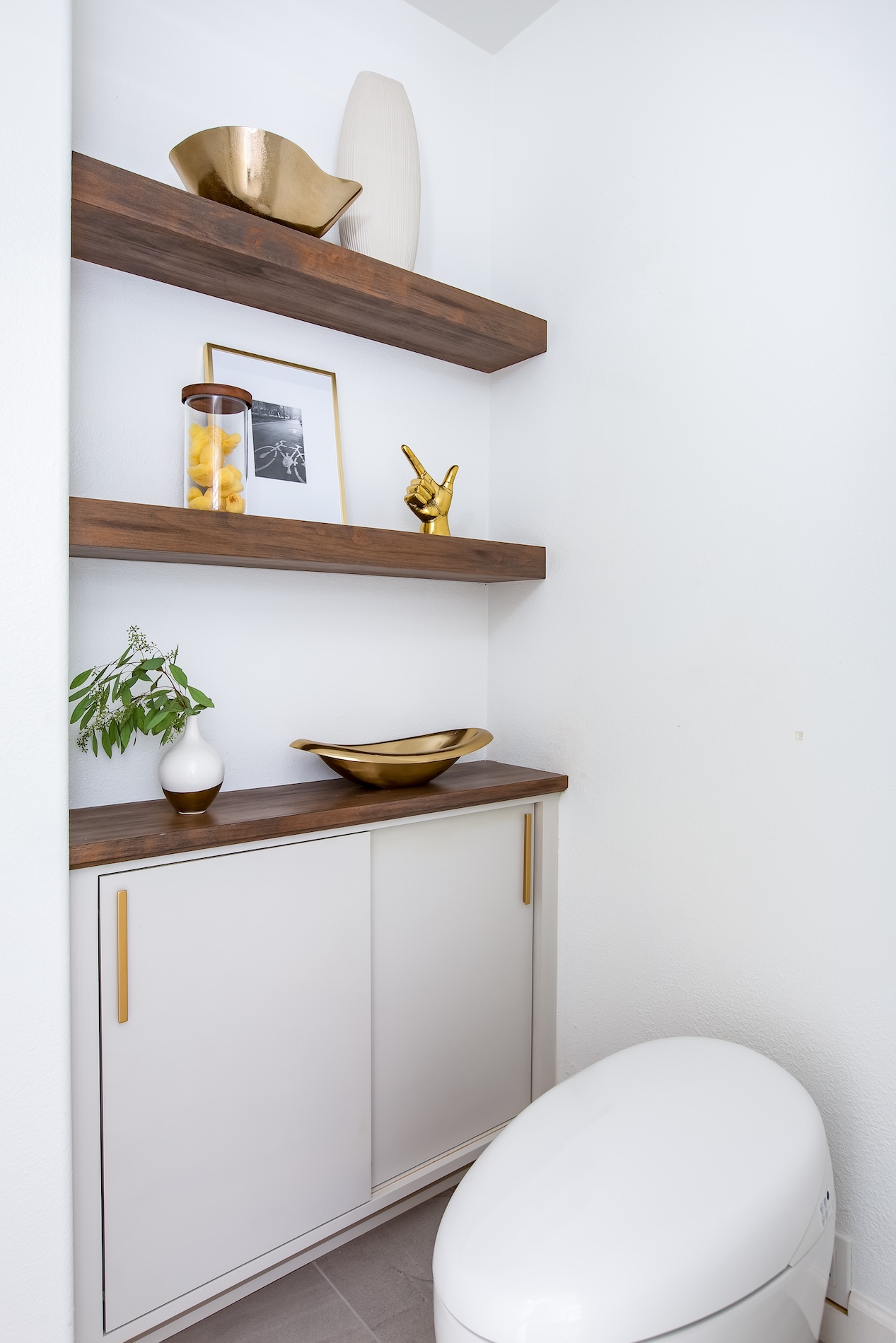 Floating Shelves Next To Modern Toilet