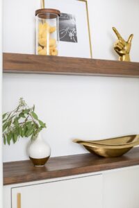 Floating Shelves With Gold Decor And Vase