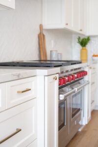 White Kitchen Cabinetry With Gold Hardware Detail