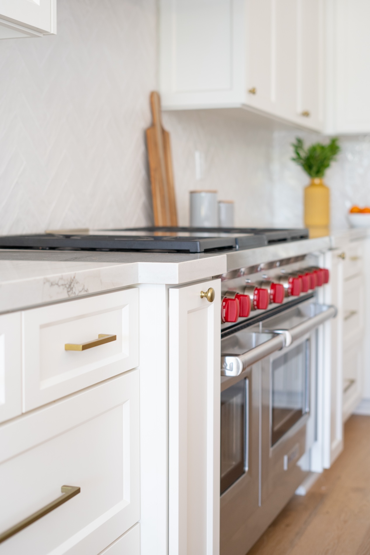 White Kitchen Cabinetry With Gold Hardware Detail